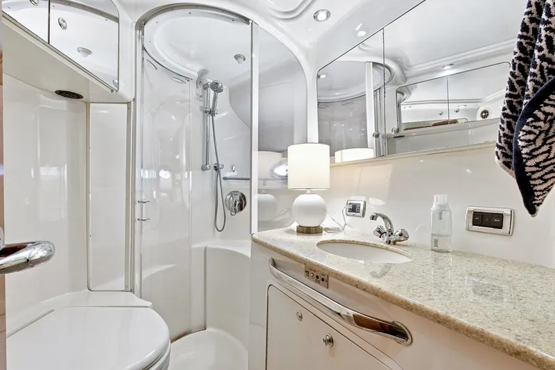 Slide: The Image of Luxurious bathroom on 2003 Sea Ray 450 Express Bridge yacht, featuring modern fixtures and elegant design. - 62