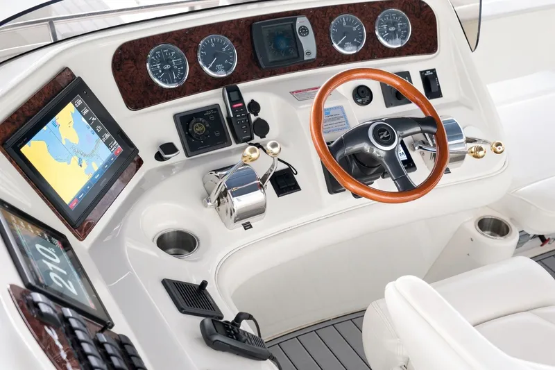 Slide: The Image of Cockpit of 2003 Sea Ray 450 Express Bridge with navigation and control instruments. - 34