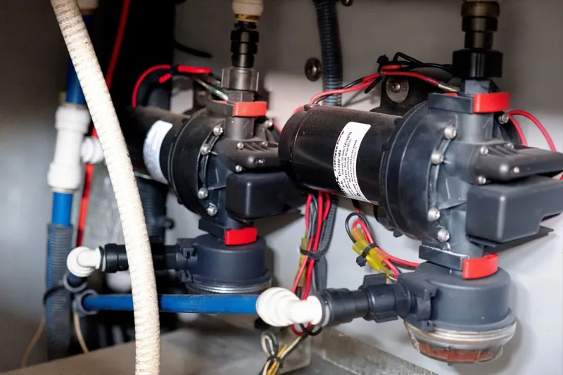 Slide: The Image of Engine compartment of a 2003 Sea Ray 450 Express Bridge with visible wiring and components. - 81