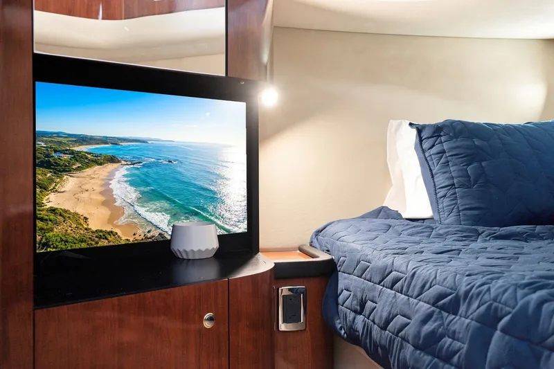 Slide: The Image of Luxurious cabin interior of 2003 Sea Ray 450 Express Bridge yacht with cozy bedding. - 65