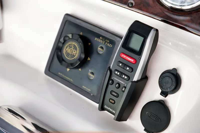 Slide: The Image of Control panel and Garmin remote on 2003 Sea Ray 450 Express Bridge yacht. - 31