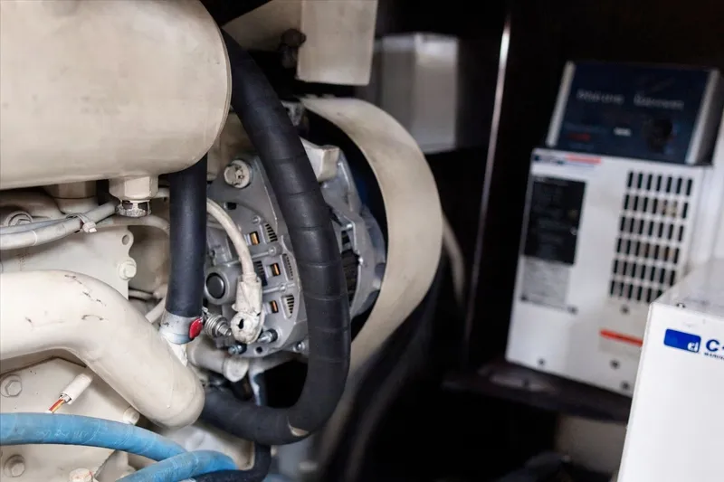 Slide: The Image of Engine compartment of a 2003 Sea Ray 450 Express Bridge yacht, showing mechanical components. - 84
