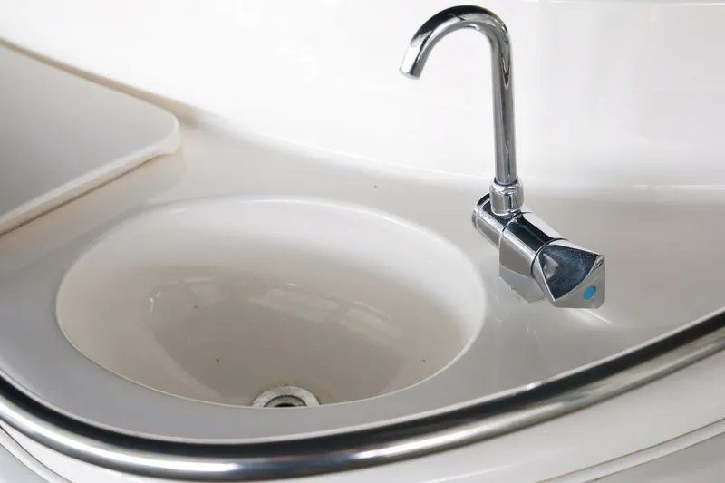 Slide: The Image of Sink and faucet on 2003 Sea Ray 450 Express Bridge yacht. - 33