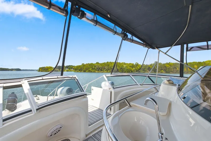 Slide: The Image of 2003 Sea Ray 450 Express Bridge yacht interior with scenic water view. - 14