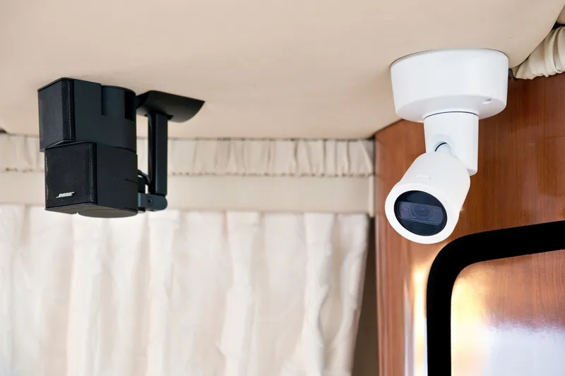 Slide: The Image of Ceiling-mounted speaker and security camera on 2003 Sea Ray 450 Express Bridge yacht. - 49