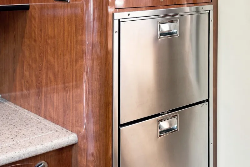 Slide: The Image of Stainless steel drawers in 2003 Sea Ray 450 Express Bridge yacht interior. - 55