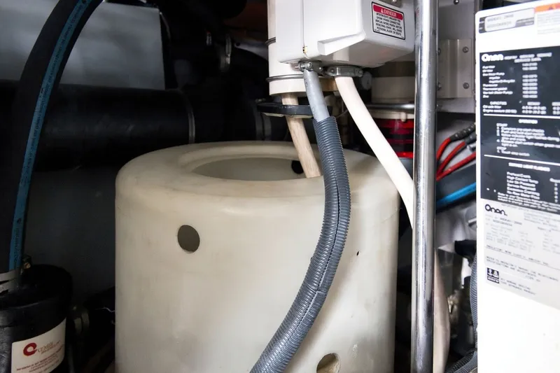Slide: The Image of Engine room of 2003 Sea Ray 450 Express Bridge with mechanical components and wiring. - 86