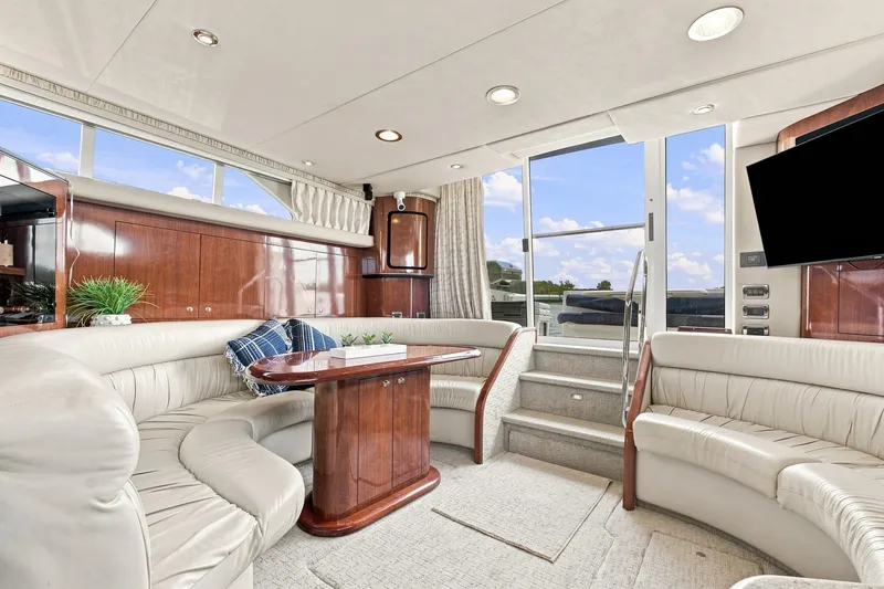 Slide: The Image of Luxurious interior of 2003 Sea Ray 450 Express Bridge yacht with plush seating and elegant decor. - 44