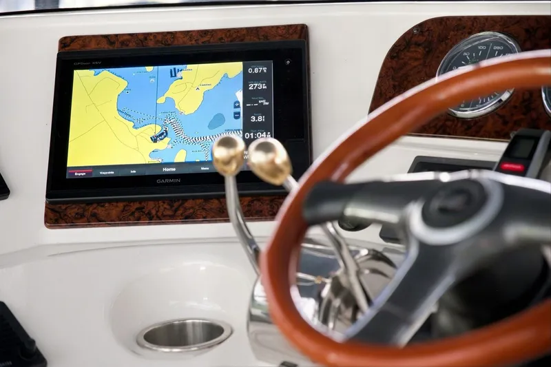 Slide: The Image of Dashboard of 2003 Sea Ray 450 Express Bridge with Garmin navigation display. - 41