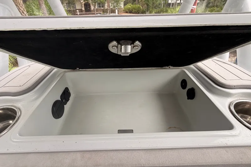 Slide: The Image of Open storage compartment on 2021 Costa Custom Boats 264HC, showcasing interior space. - 31