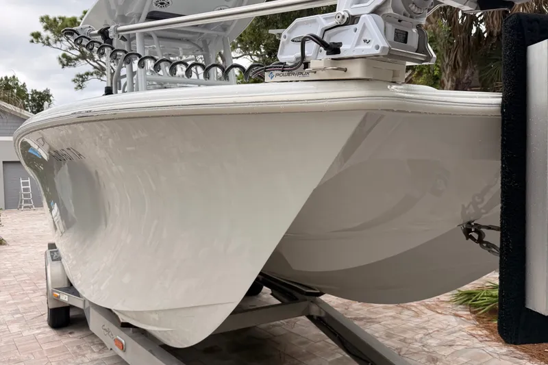Slide: The Image of 2021 Costa Custom Boats 264HC on trailer, showcasing sleek hull design. - 28