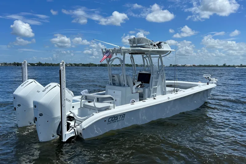 The Image of 2021 Costa Custom Boats 264HC on water, featuring dual Mercury engines and sleek design. - 1
