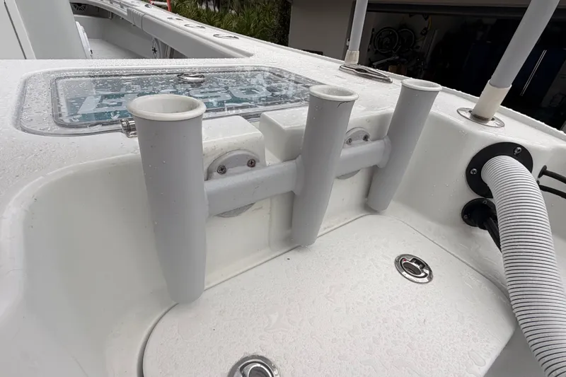 Slide: The Image of Rod holders on a 2021 Costa Custom Boats 264HC, featuring a sleek, wet deck design. - 9