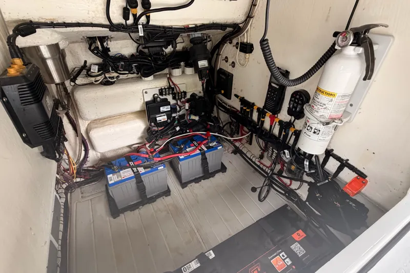 Slide: The Image of Electrical system of 2021 Costa Custom Boats 264HC, featuring batteries and wiring. - 35