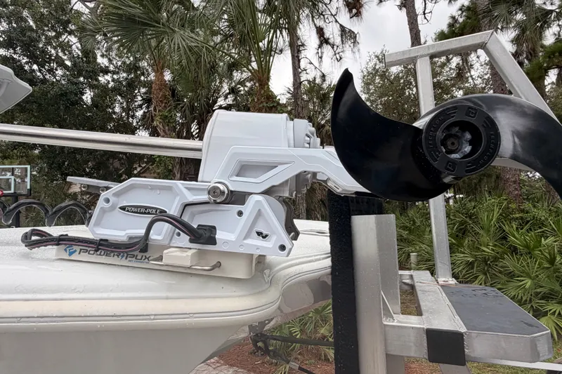 Slide: The Image of 2021 Costa Custom Boats 264HC with Power-Pole anchor system, surrounded by lush greenery. - 26