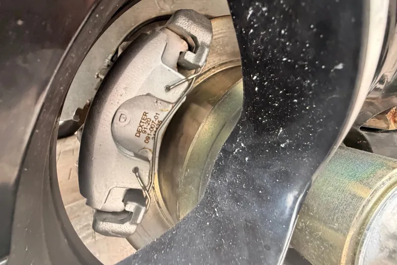 Slide: The Image of Close-up of a 2021 Costa Custom Boats 264HC brake caliper and rotor. - 42