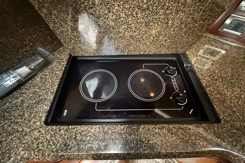 Slide: The Image of Granite countertop with electric stove on 2007 Sea Ray 40 Motor Yacht. - 65