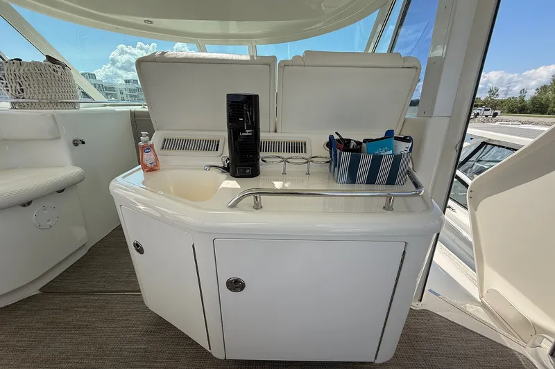 Slide: The Image of 2007 Sea Ray 40 Motor Yacht interior with sink, fan, and storage compartments. - 29