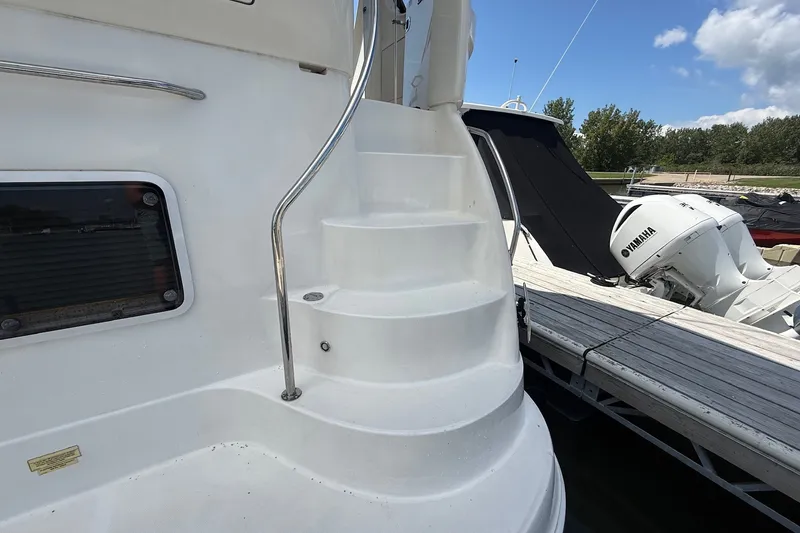 Slide: The Image of Staircase on 2007 Sea Ray 40 Motor Yacht docked beside Yamaha engine. - 9