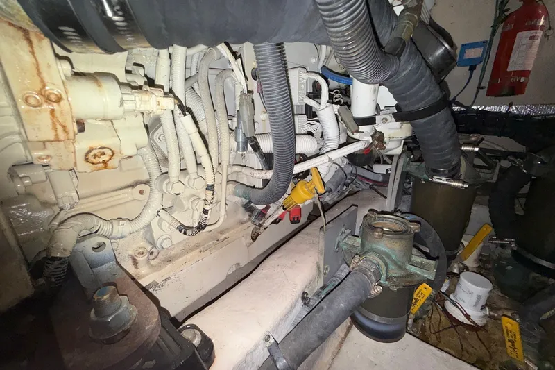 Slide: The Image of Engine room of a 2007 Sea Ray 40 Motor Yacht, showcasing complex wiring and components. - 112