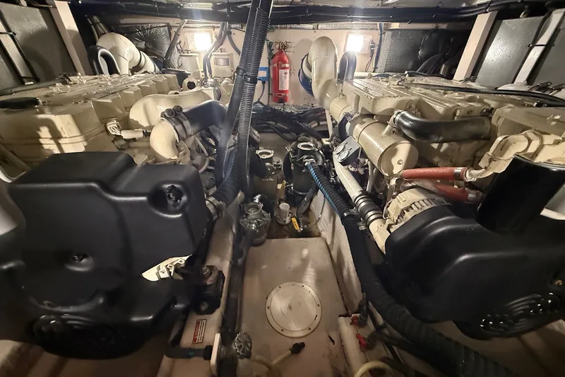 Slide: The Image of Engine room of a 2007 Sea Ray 40 Motor Yacht, showcasing dual engines and equipment. - 99