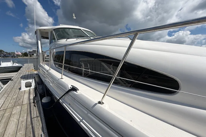 Slide: The Image of 2007 Sea Ray 40 Motor Yacht docked under cloudy sky. - 14