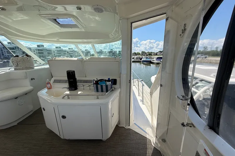 Slide: The Image of Interior view of 2007 Sea Ray 40 Motor Yacht with marina backdrop. - 26