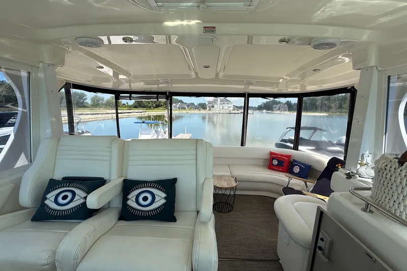 Slide: The Image of Interior of 2007 Sea Ray 40 Motor Yacht with plush seating and decorative pillows. - 51