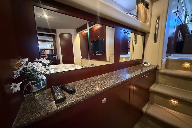 Slide: The Image of Luxurious interior of 2007 Sea Ray 40 Motor Yacht with elegant wood finishes. - 88