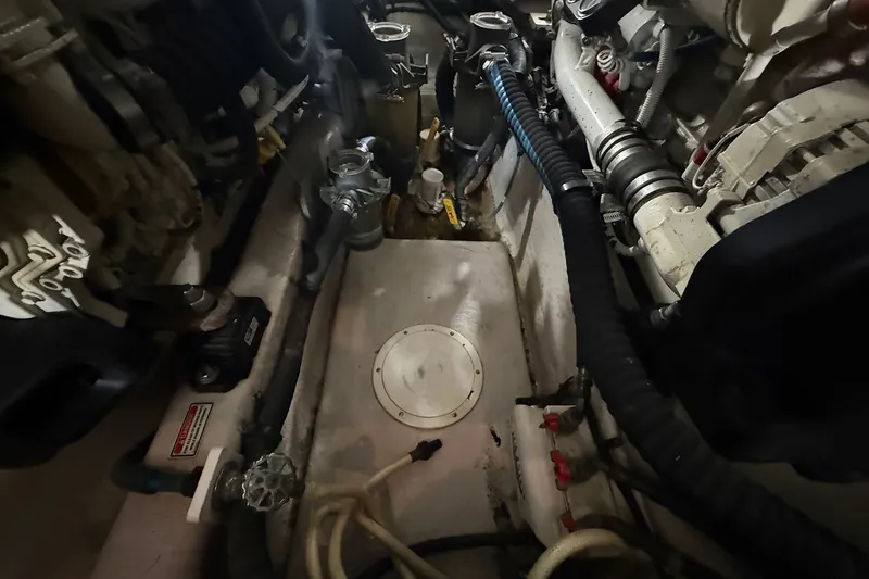 Slide: The Image of Engine room of a 2007 Sea Ray 40 Motor Yacht, showcasing mechanical components. - 102