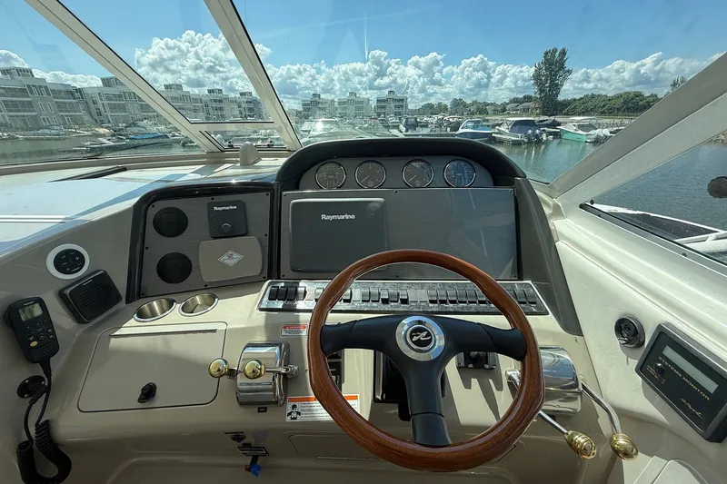 Slide: The Image of Helm of 2007 Sea Ray 40 Motor Yacht with steering wheel and navigation instruments. - 42