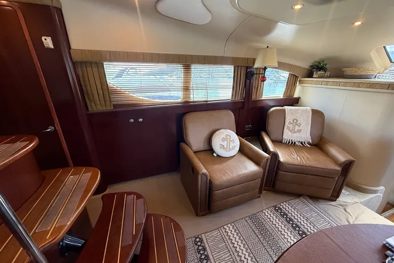 Slide: The Image of Luxurious 2007 Sea Ray 40 Motor Yacht interior with leather chairs and nautical decor. - 59