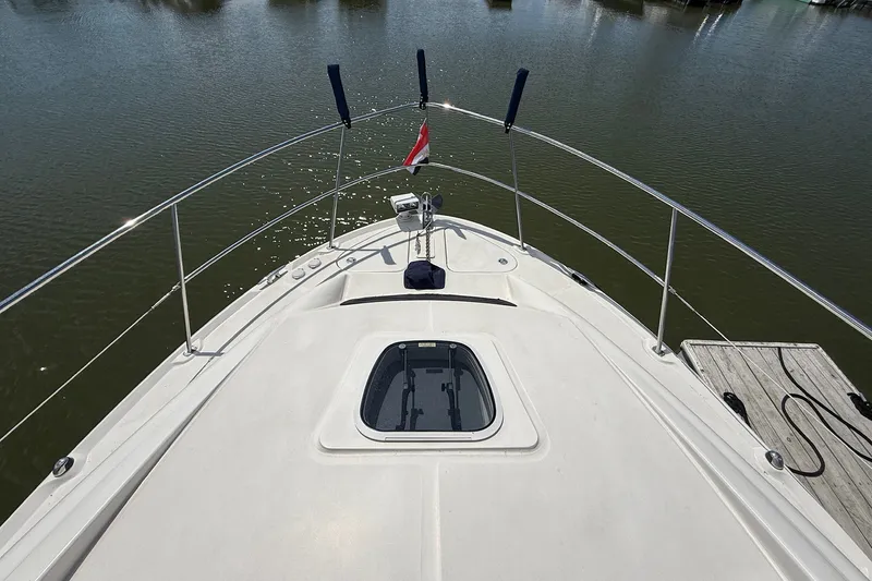 Slide: The Image of Bow view of 2007 Sea Ray 40 Motor Yacht on calm water. - 18