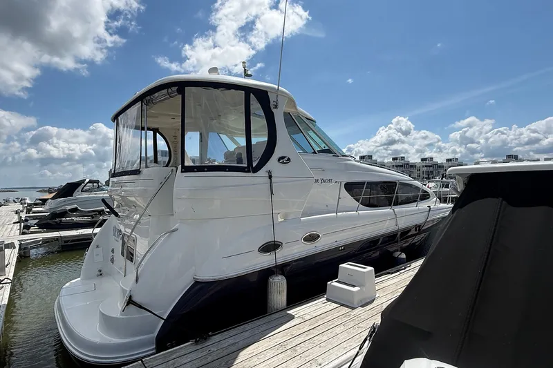 Slide: The Image of 2007 Sea Ray 40 Motor Yacht docked under a bright blue sky. - 6