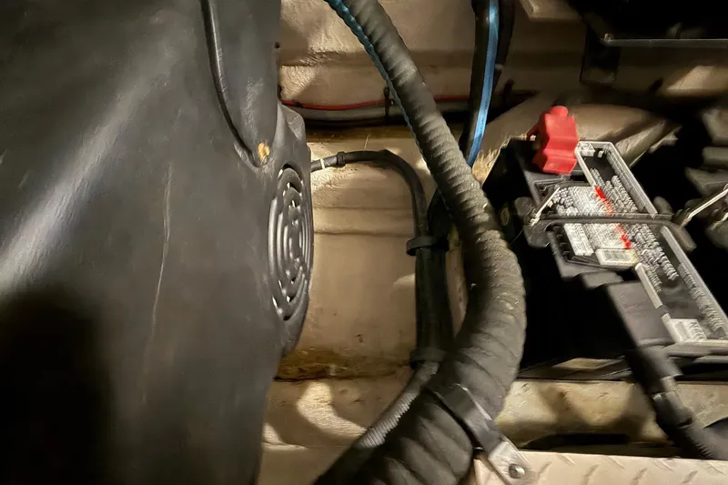 Slide: The Image of Engine compartment of a 2007 Sea Ray 40 Motor Yacht, featuring wiring and battery components. - 111