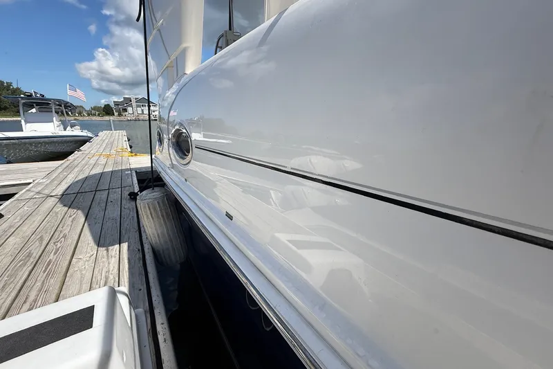 Slide: The Image of 2007 Sea Ray 40 Motor Yacht docked, showcasing sleek white hull and marina setting. - 16