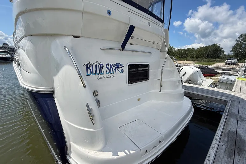 Slide: The Image of 2007 Sea Ray 40 Motor Yacht docked, featuring "Another Blue Sky" name on the stern. - 4