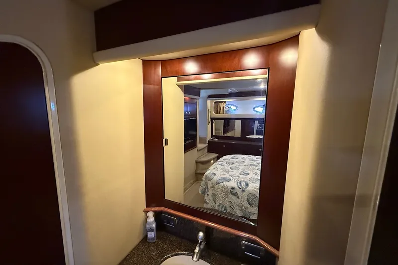 Slide: The Image of Luxurious 2007 Sea Ray 40 Motor Yacht interior with mirror and cozy bedroom view. - 92
