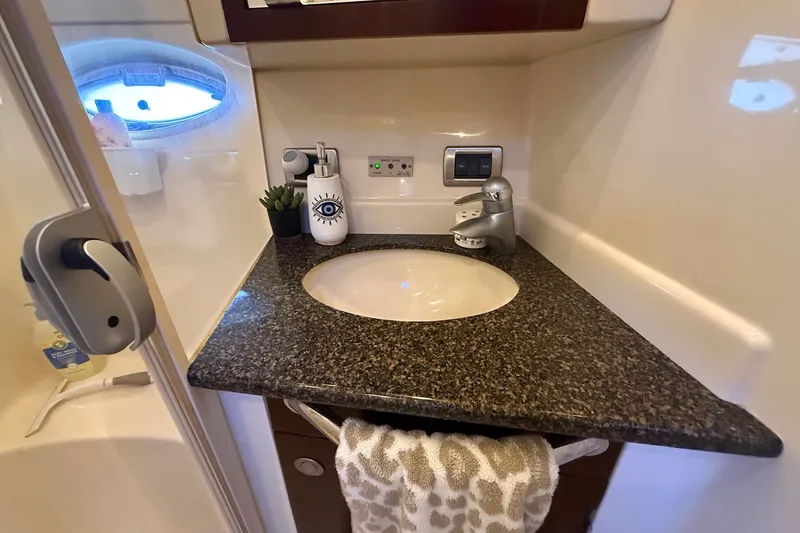 Slide: The Image of Luxurious 2007 Sea Ray 40 Motor Yacht bathroom with granite countertop and modern fixtures. - 73