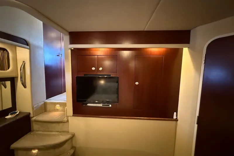 Slide: The Image of Interior of 2007 Sea Ray 40 Motor Yacht with TV and wooden cabinetry. - 86