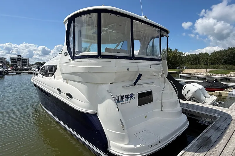 Slide: The Image of 2007 Sea Ray 40 Motor Yacht docked in a marina under a clear sky. - 2