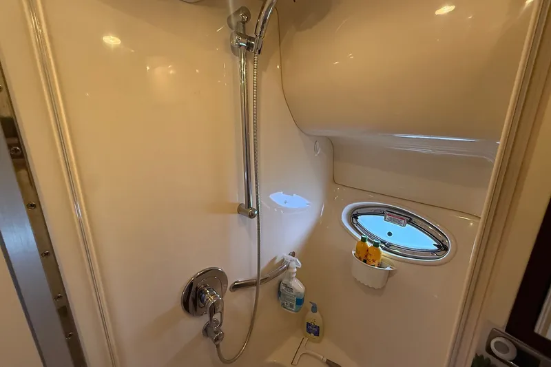 Slide: The Image of Shower area in 2007 Sea Ray 40 Motor Yacht with porthole and toiletries. - 75