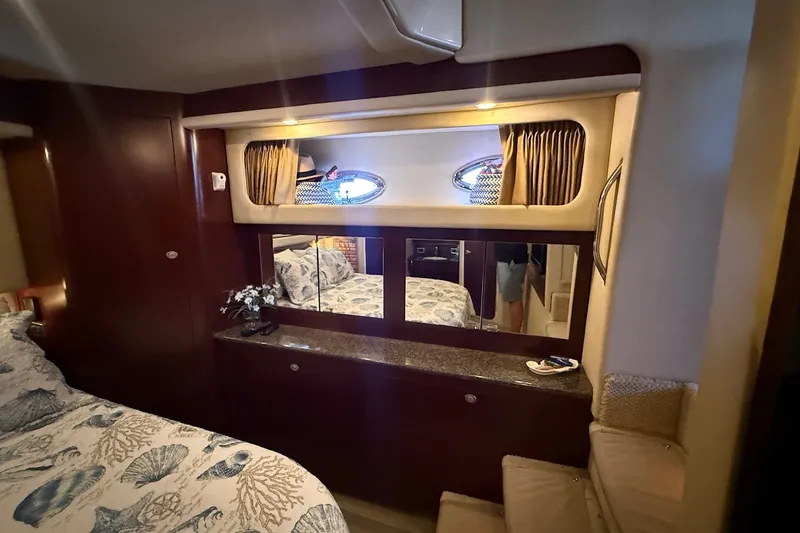Slide: The Image of Luxurious 2007 Sea Ray 40 Motor Yacht cabin with elegant wood finishes and nautical decor. - 87