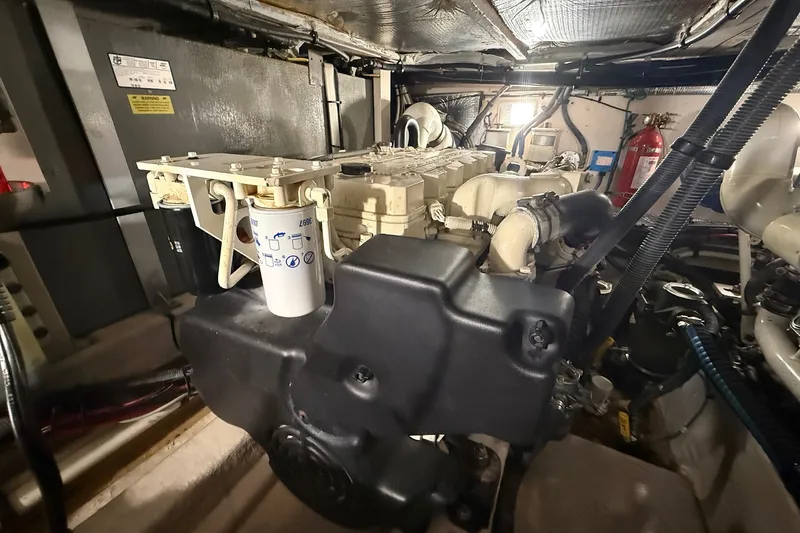 Slide: The Image of Engine room of 2007 Sea Ray 40 Motor Yacht, showcasing mechanical components and systems. - 100