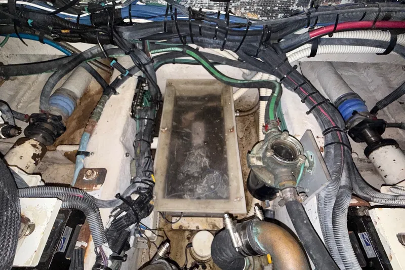 Slide: The Image of Engine compartment of a 2007 Sea Ray 40 Motor Yacht with visible wiring and components. - 114