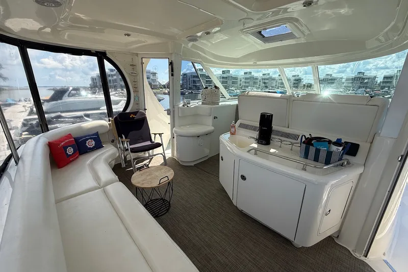 Slide: The Image of Luxurious interior of a 2007 Sea Ray 40 Motor Yacht with seating and kitchenette. - 25