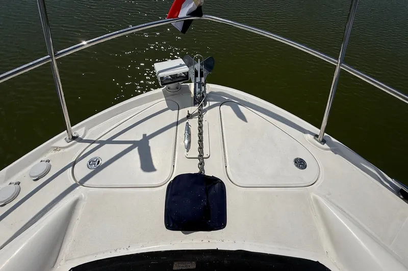 Slide: The Image of Bow view of 2007 Sea Ray 40 Motor Yacht on calm water. - 19