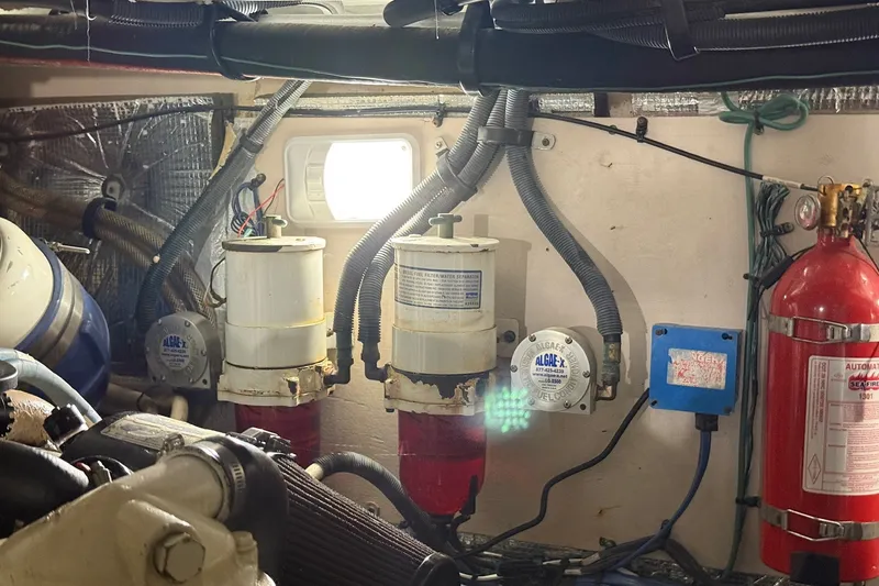 Slide: The Image of Engine room of a 2007 Sea Ray 40 Motor Yacht with filters and fire extinguisher. - 109