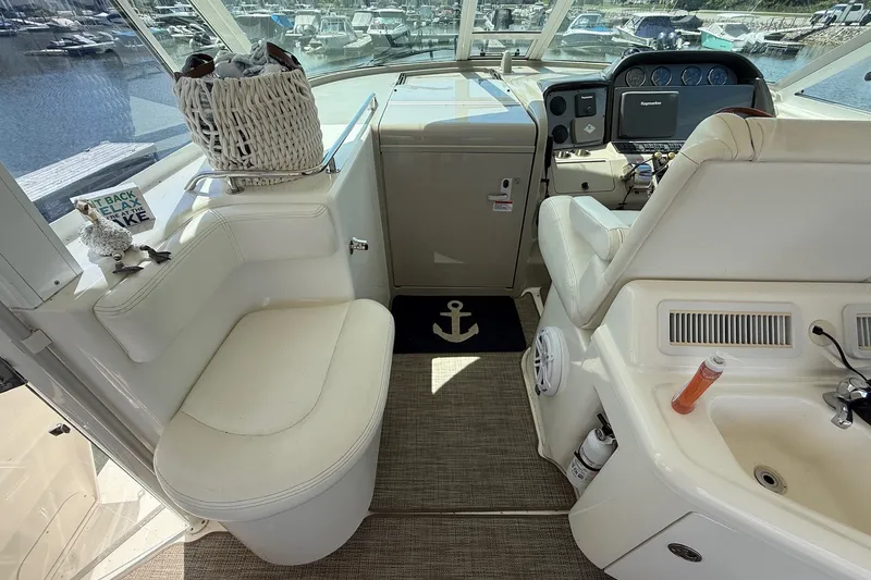 Slide: The Image of Interior of a 2007 Sea Ray 40 Motor Yacht with helm and seating area. - 38