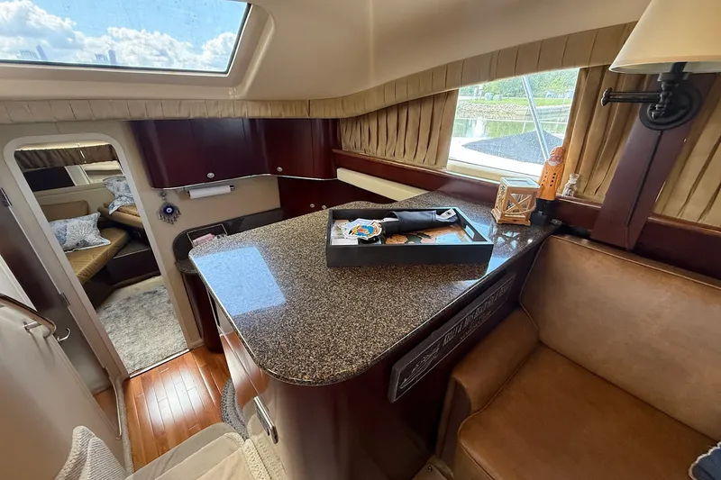 Slide: The Image of Luxurious interior of 2007 Sea Ray 40 Motor Yacht with elegant seating and granite countertop. - 61